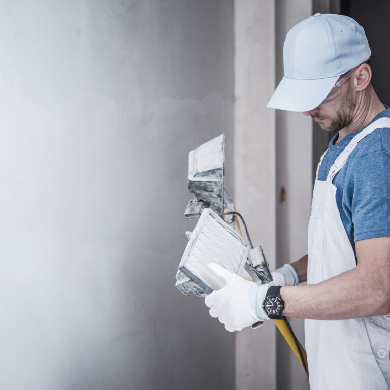 Caucasian Construction Worker in His 30s with Heavy Duty Grade Construction Lighting